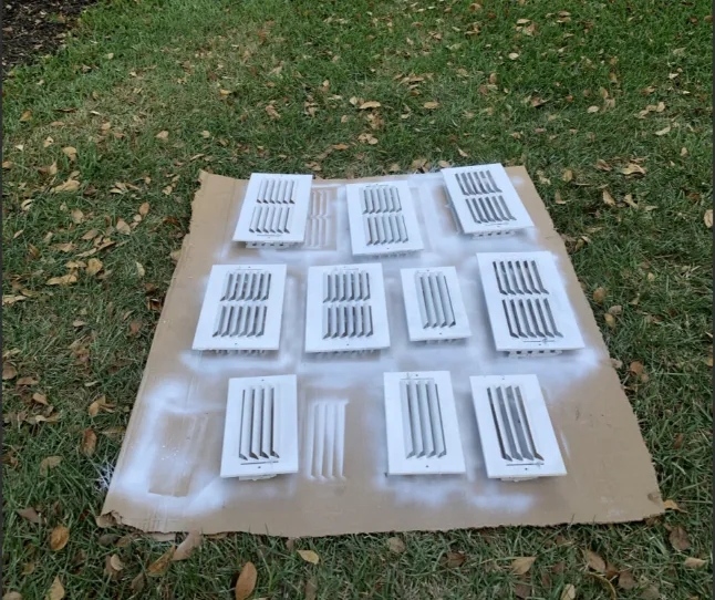 HomePros technician removing air duct registers for cleaning