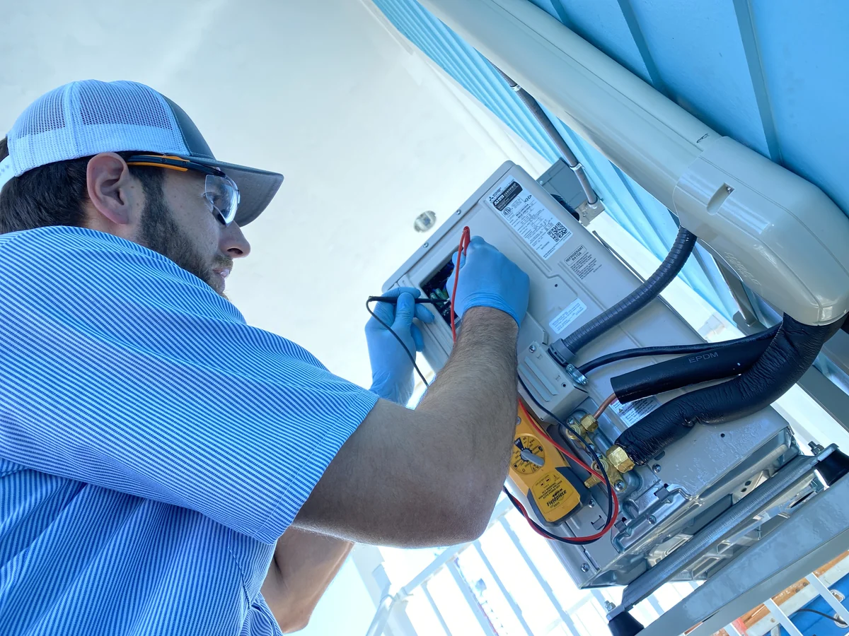 HomePros Cooling & Heating technician performing expert AC diagnostic work in Fort Myers